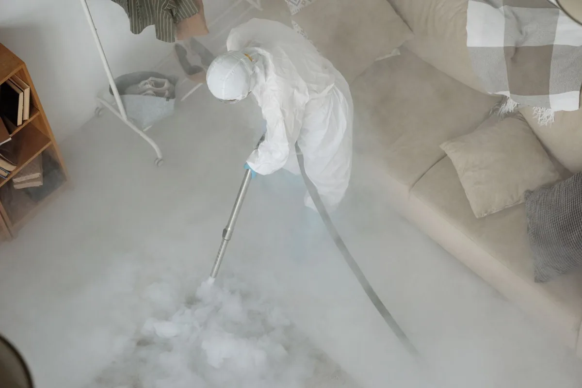 Biohazard cleanup technician in protective equipment, Brilliant, OH